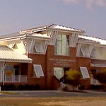 A town hall building with white roof