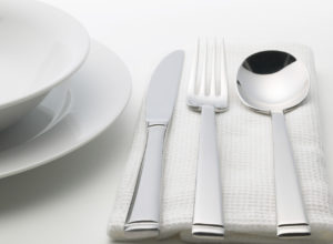 White color dining set with spoons and forks